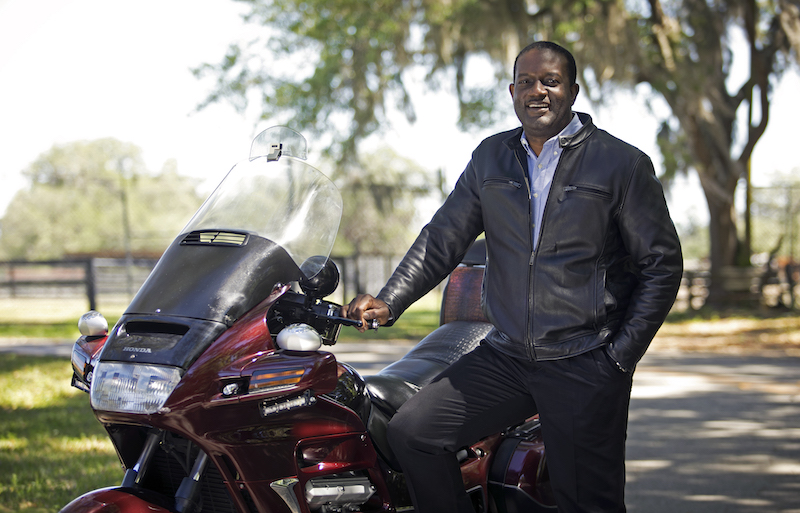 Gbola Adesogan with his motorcycle 