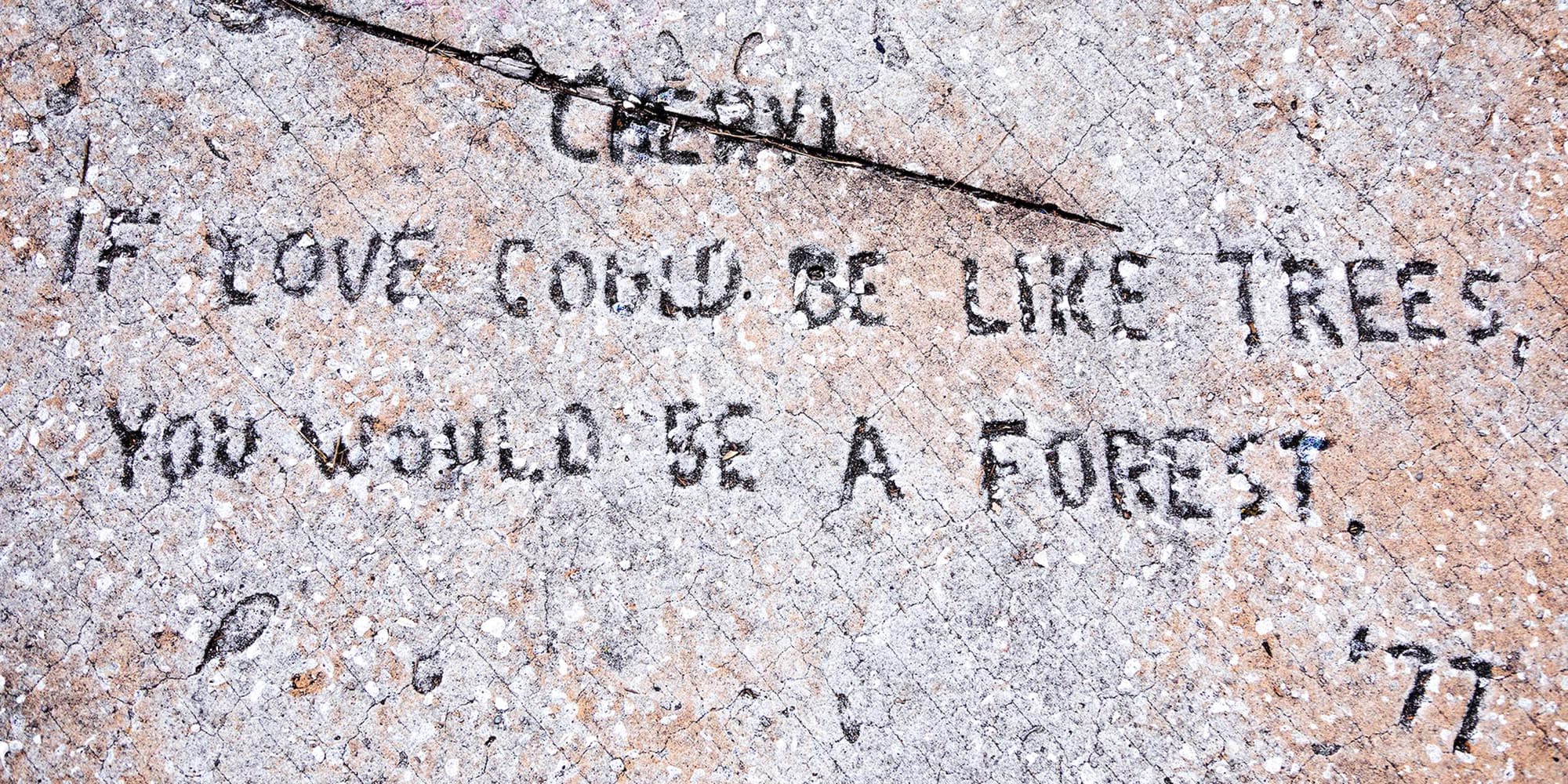 An inscription in concrete reads 