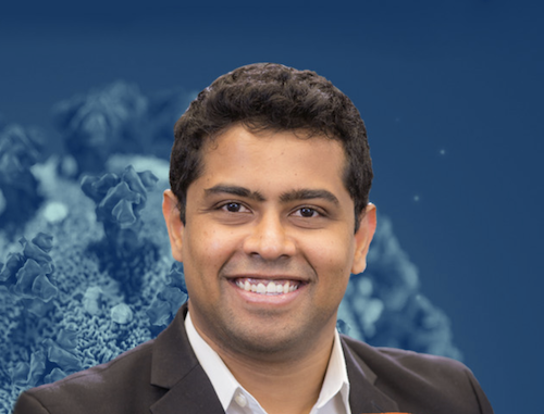 Professor Piyush Jain with a background of coronavirus graphics