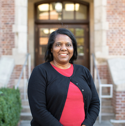 Professor Sharon Austin stands in front of Walker Hall at UF