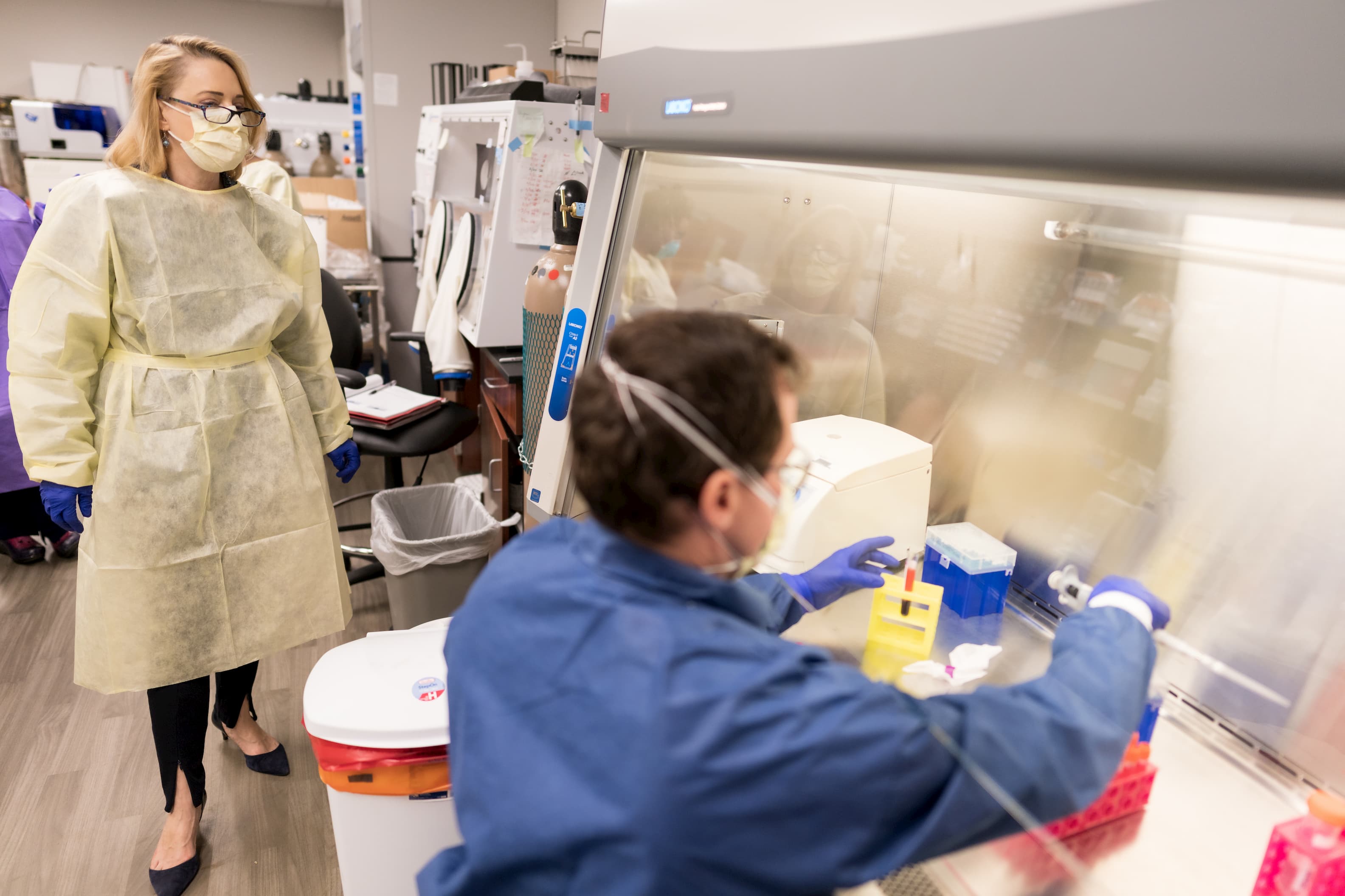 Two people work in a lab setting.