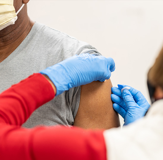 George Trotman, 68, receives a COVID-19 vaccination from a UF Health vaccinator at the Mt. Moriah Missionary Baptist Church in Gainesville recently. 