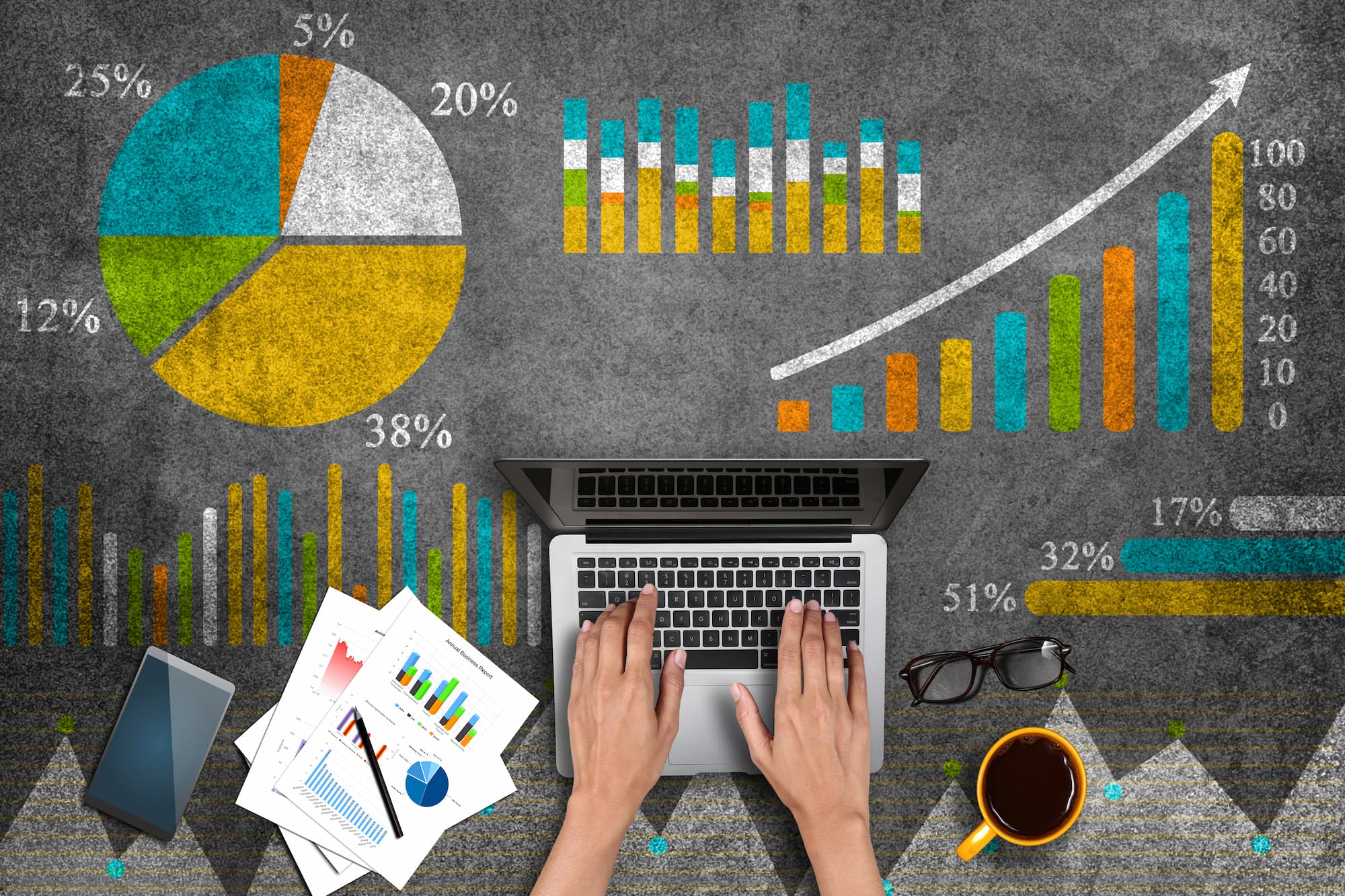 A graphic depicting charts, numbers and a person's hands typing on a laptop