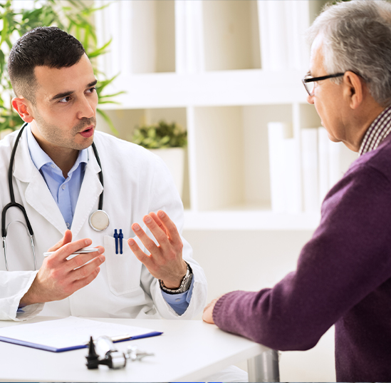 A male patient speaks with his doctor.