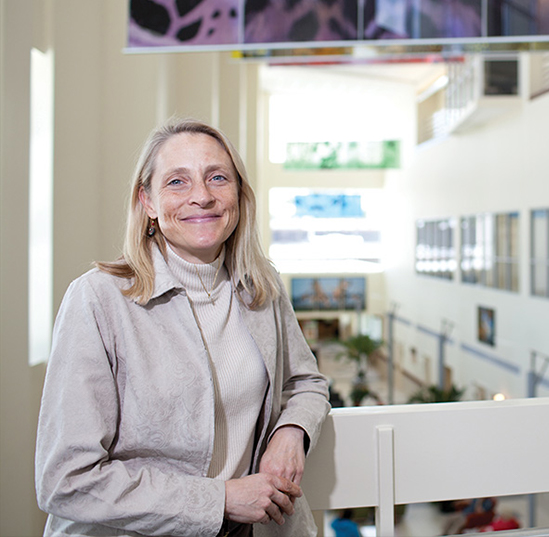 Dana Zimmel poses for a photo while smiling 