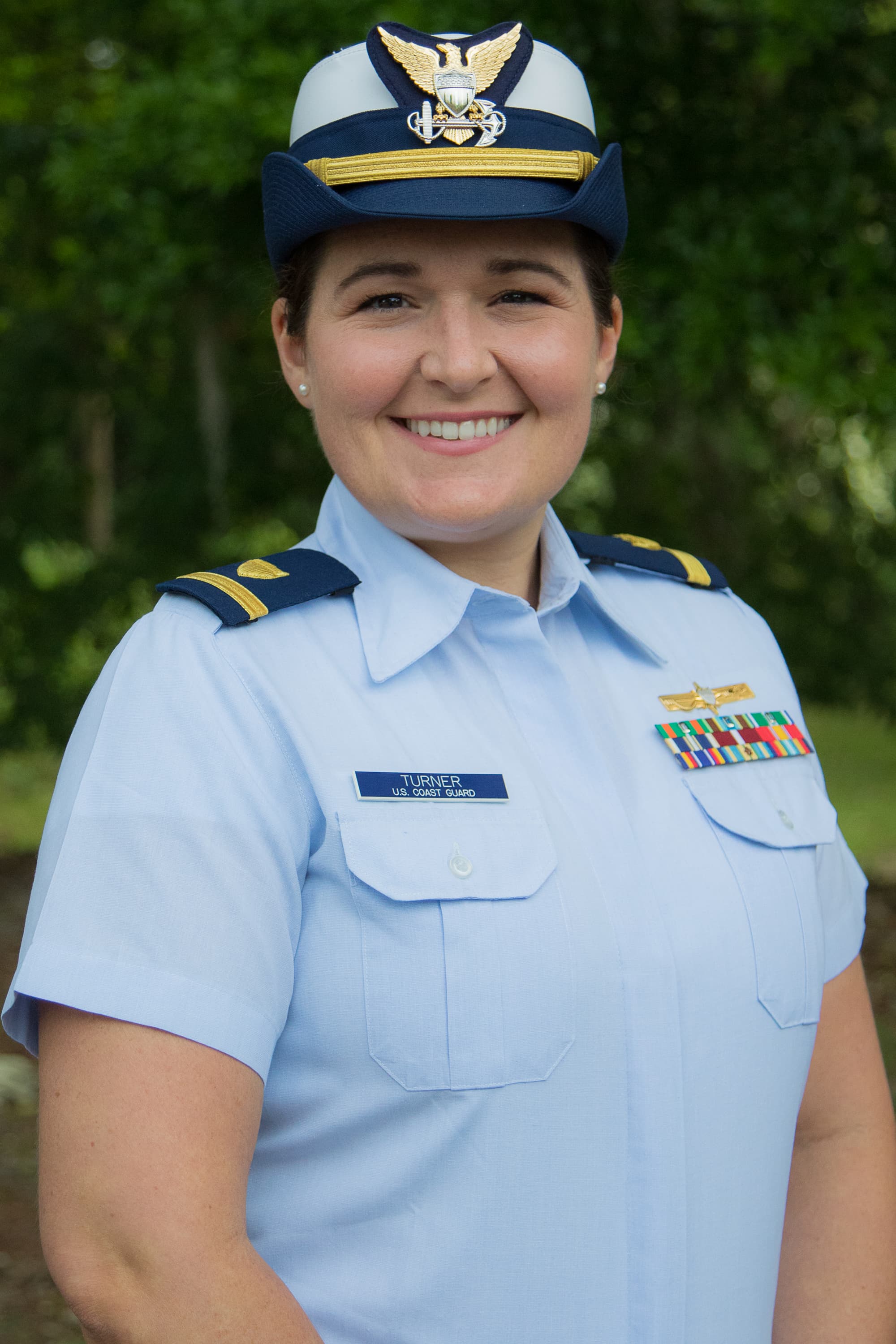 UF PhD student Savanna Turner smiles as she poses for a photo in her US Coast Guard uniform. 