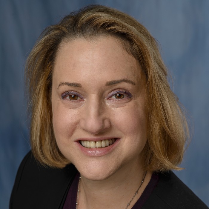 A headshot of a woman