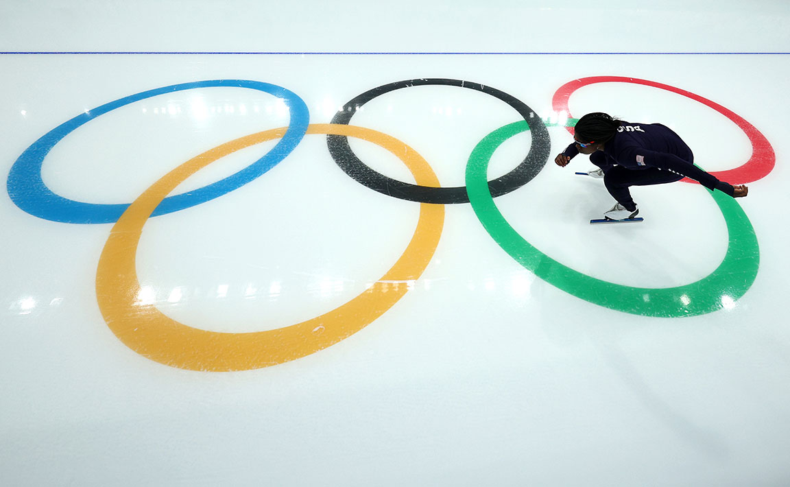 An Olympian skates on the ice