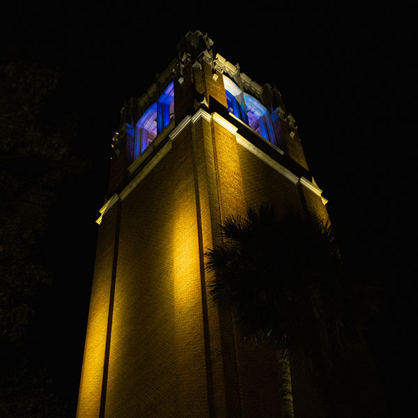 UF's Century Tower is lit in the blue and yellow, the colors of the Ukrainian flag. 