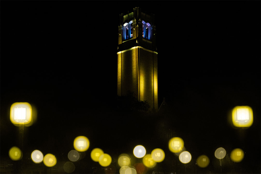 UF's Century Tower is lit in the blue and yellow, the colors of the Ukrainian flag. 