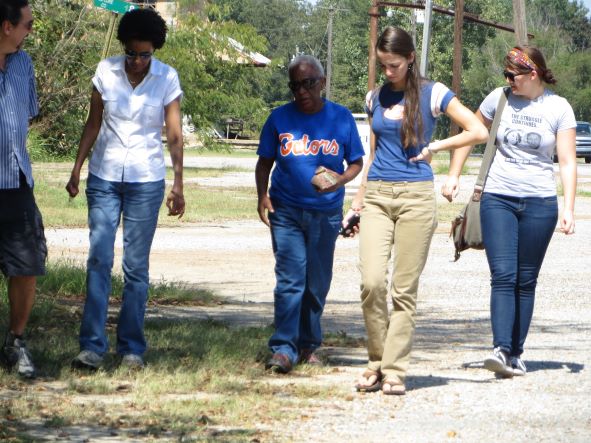 A group of people walking along a road.