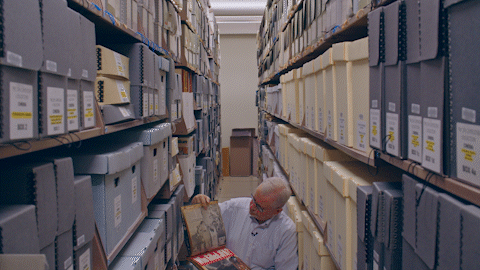 A man browsing the library archives