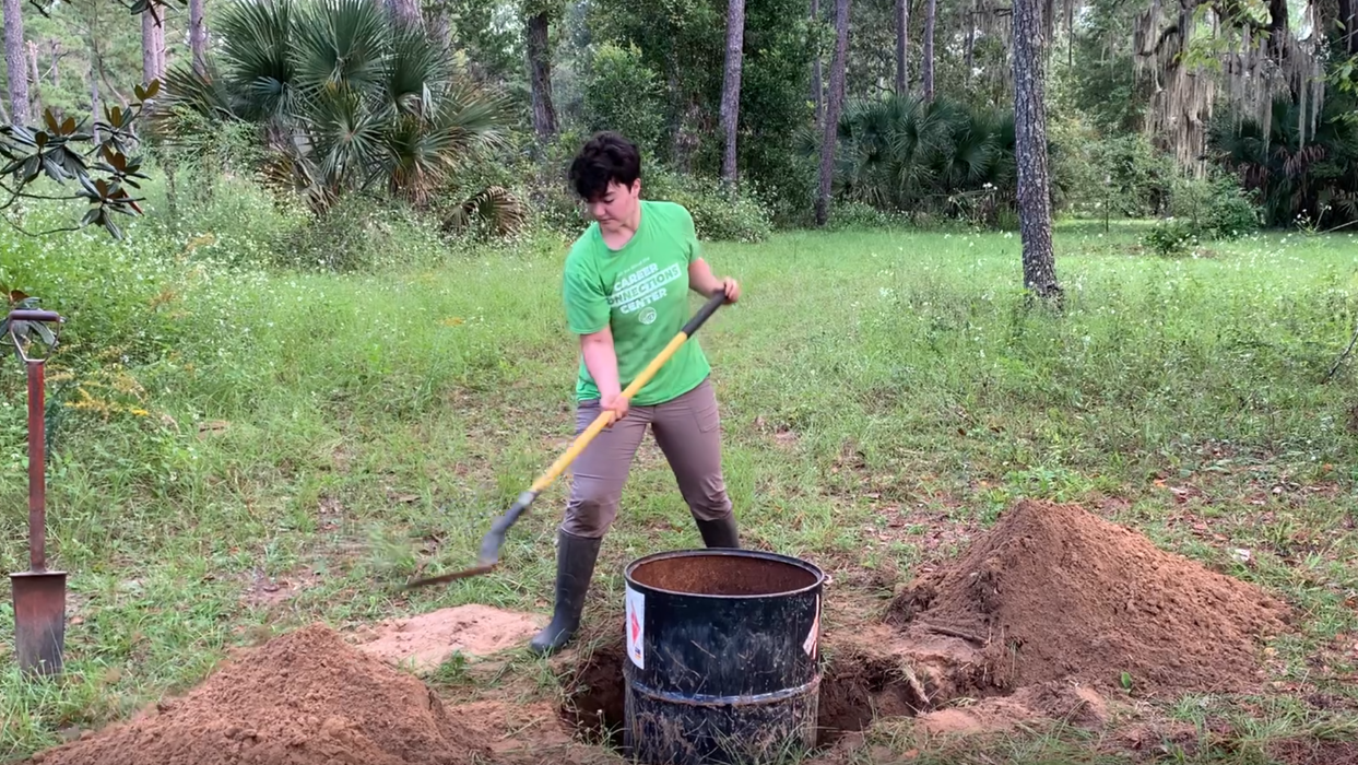 Veronica Selden digs around a gopher burrow