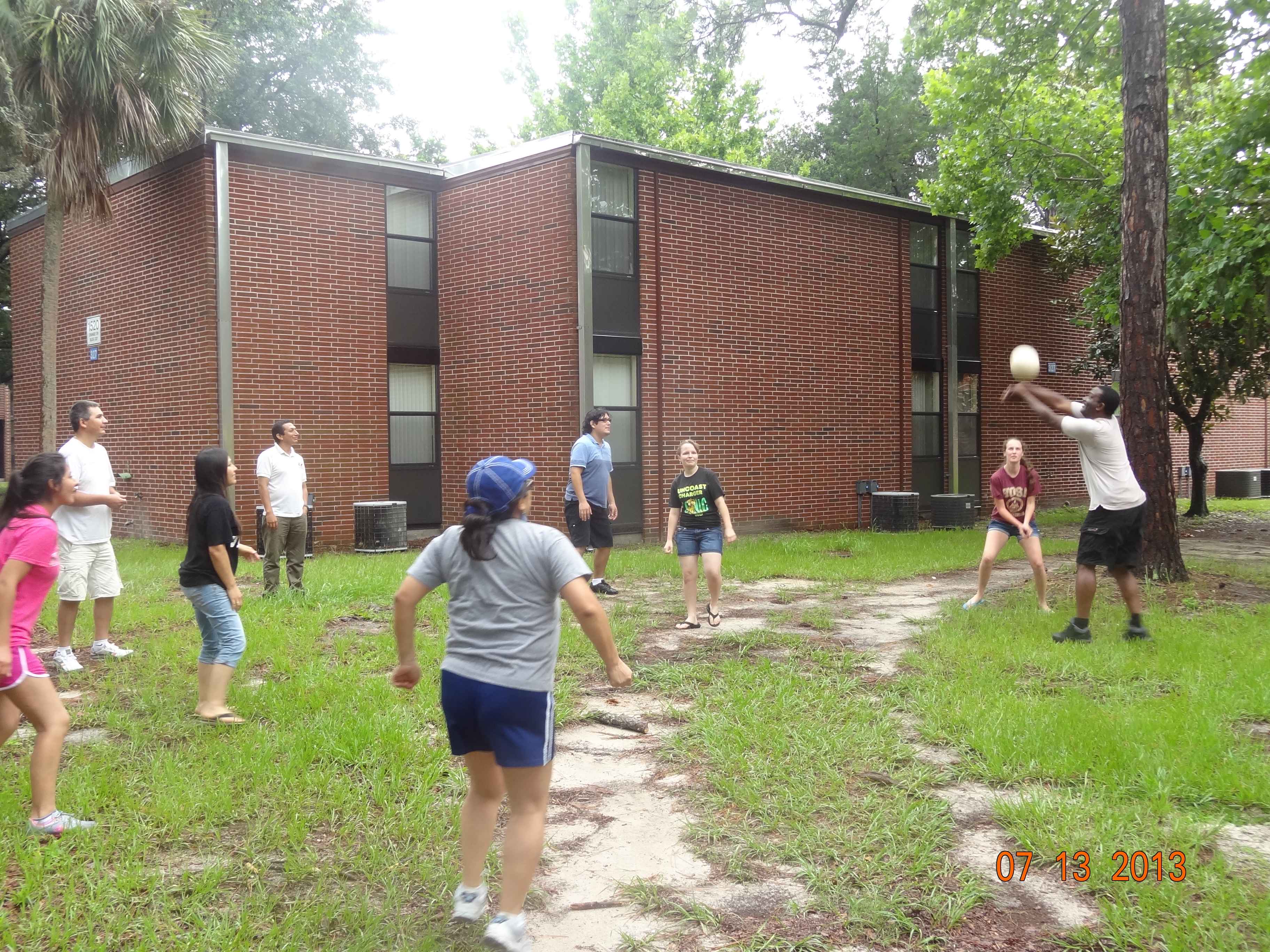 Children play outside of a building.