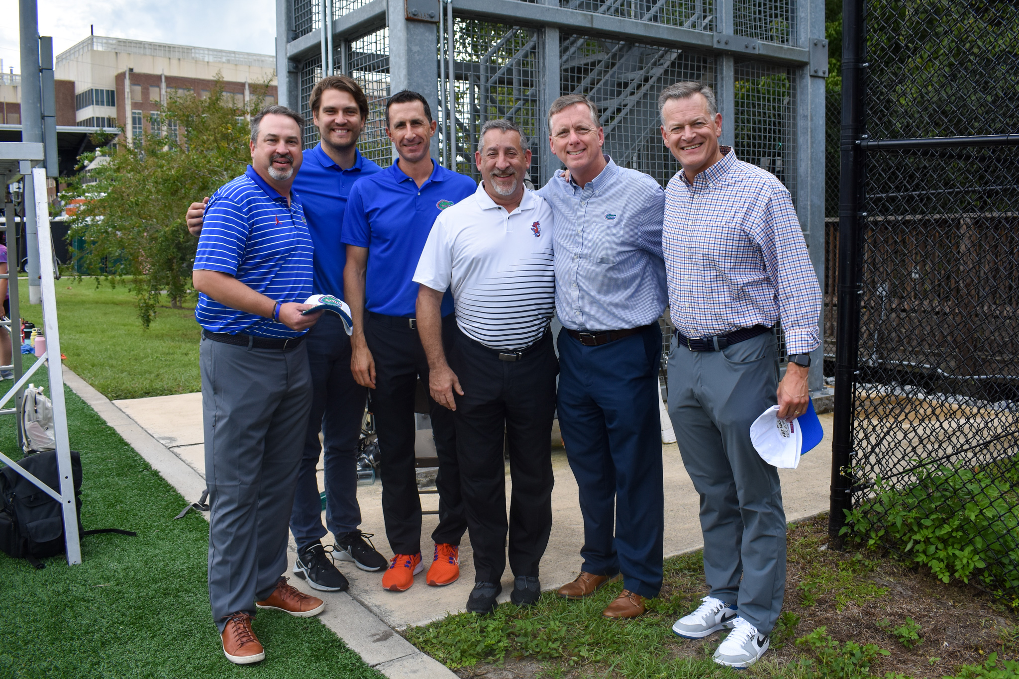 Six men pose for a photo.