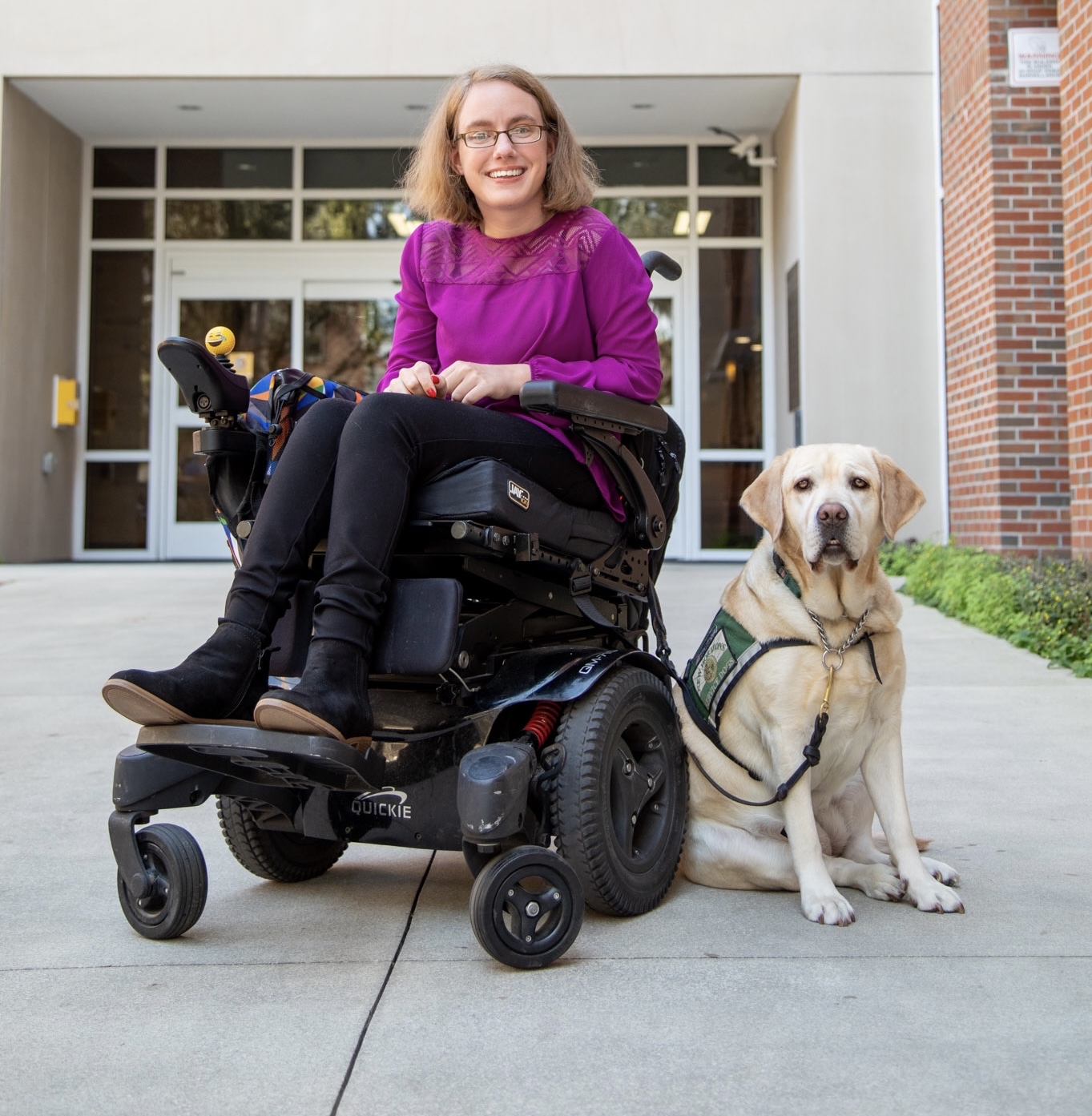Photo of Robyn Clarke and her service dog