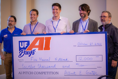 Five men holding an oversized check for $12,000