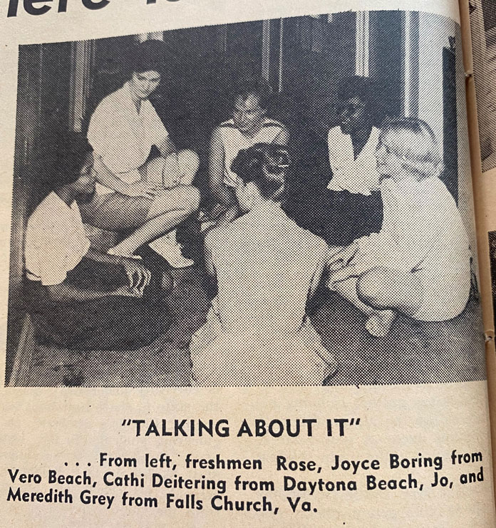 A newspaper clipping of a group of girls from the 1960s sitting in a circle.