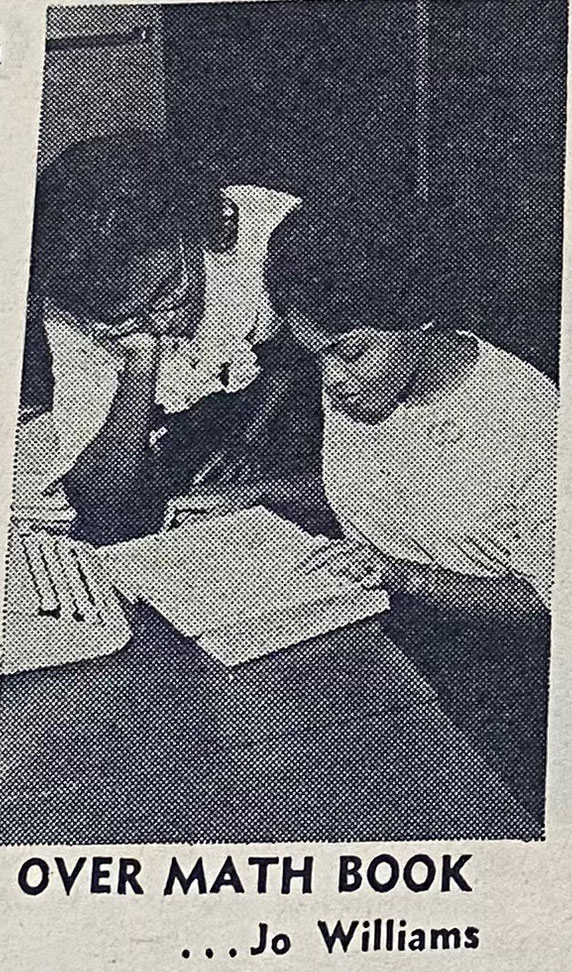 A newspaper clipping from 1962 of two students studying.