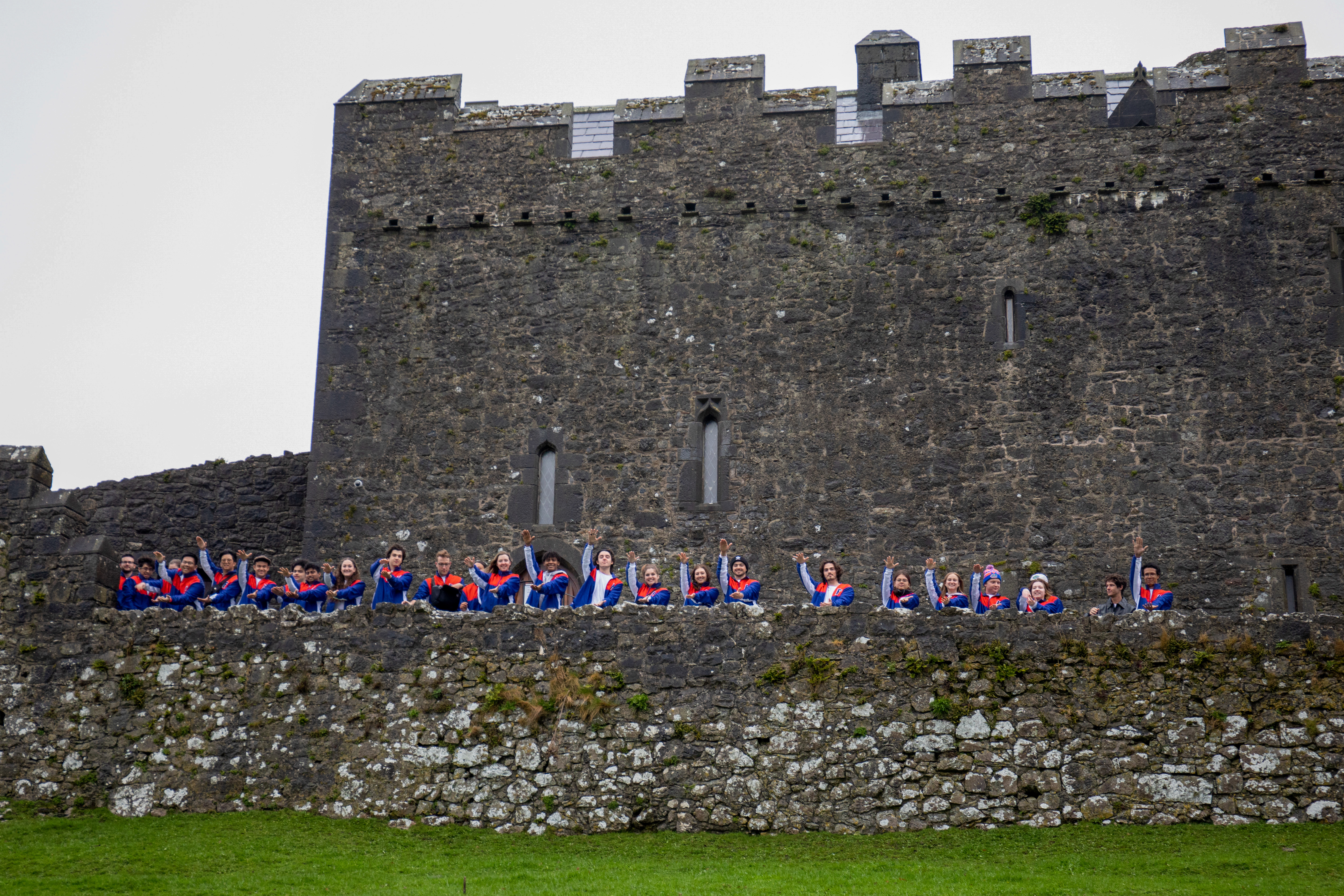 Students do a Gator Chomp at the Rock of Cashel.