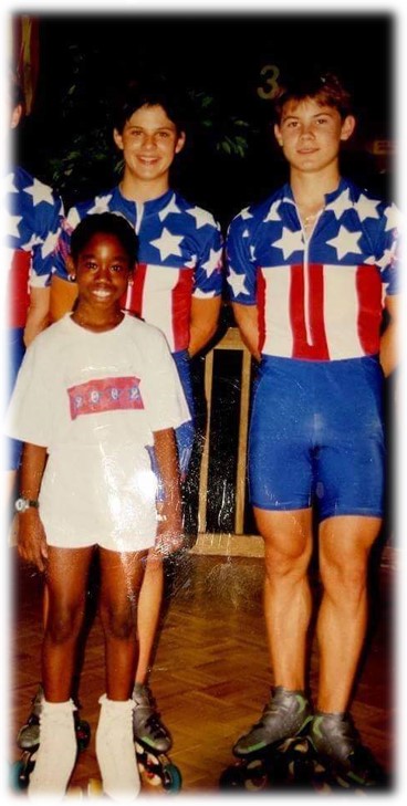 A picture of a young girl with an teenaged girl and a teenaged boy.