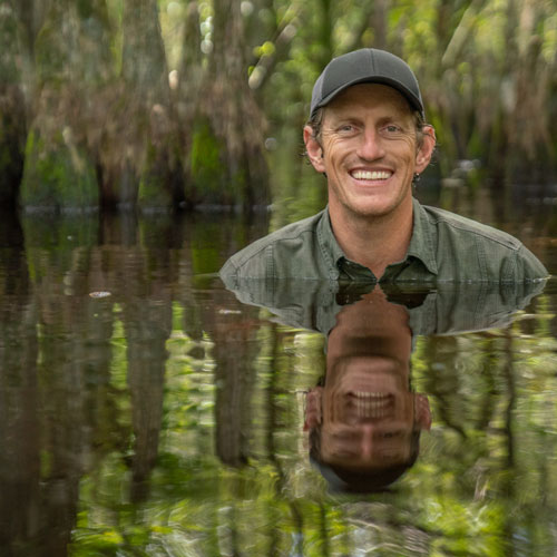 A headshot of Carlton Ward Jr. sitting in a Florida waterway.