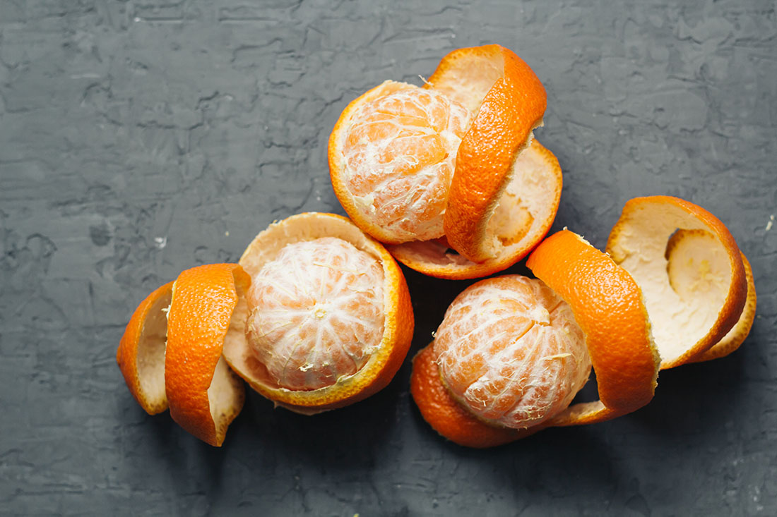 view of oranges half peeled