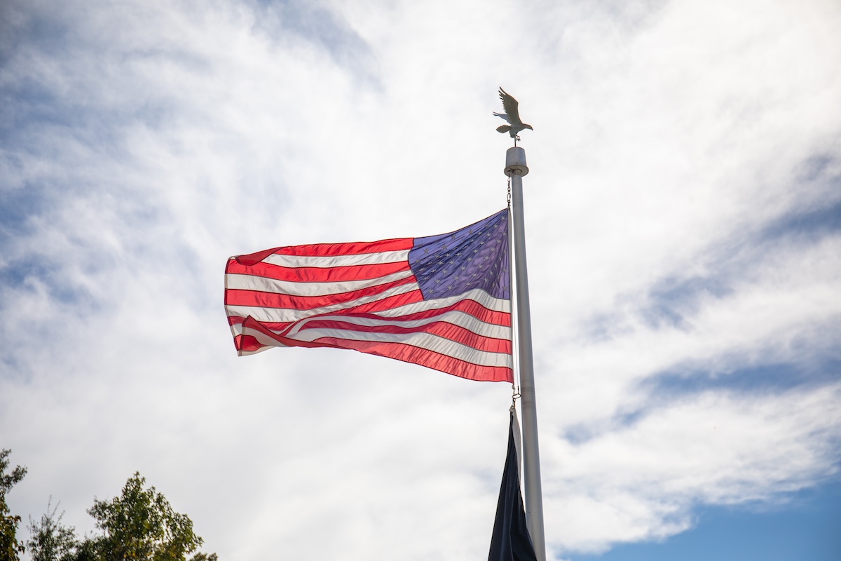photo of American flag on flag pole