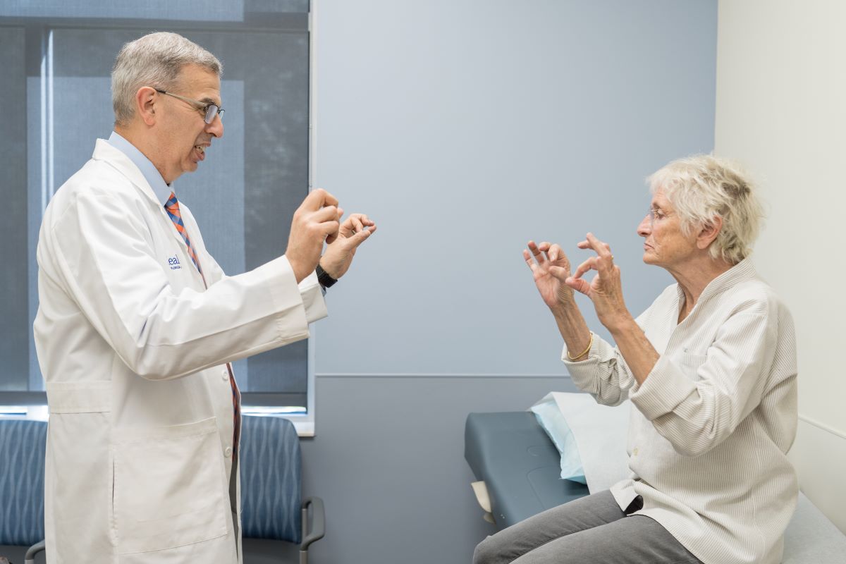 clinician and patient performing finger tapping test