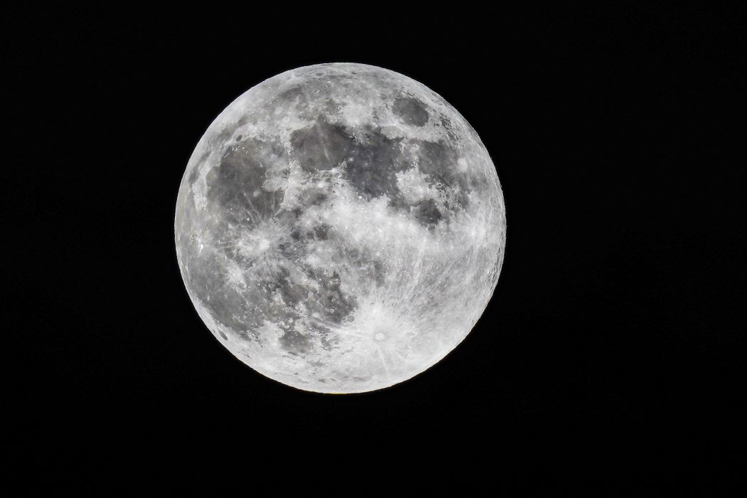 A close up view of the moon against a black night sky