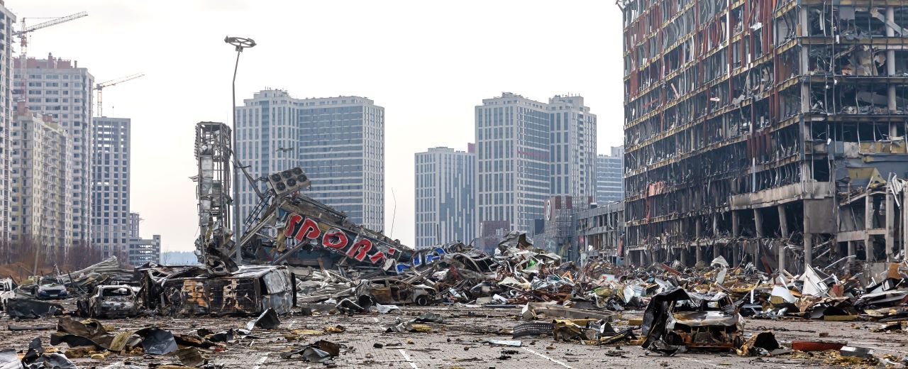 Photo of a city street and damaged buildings in Ukraine