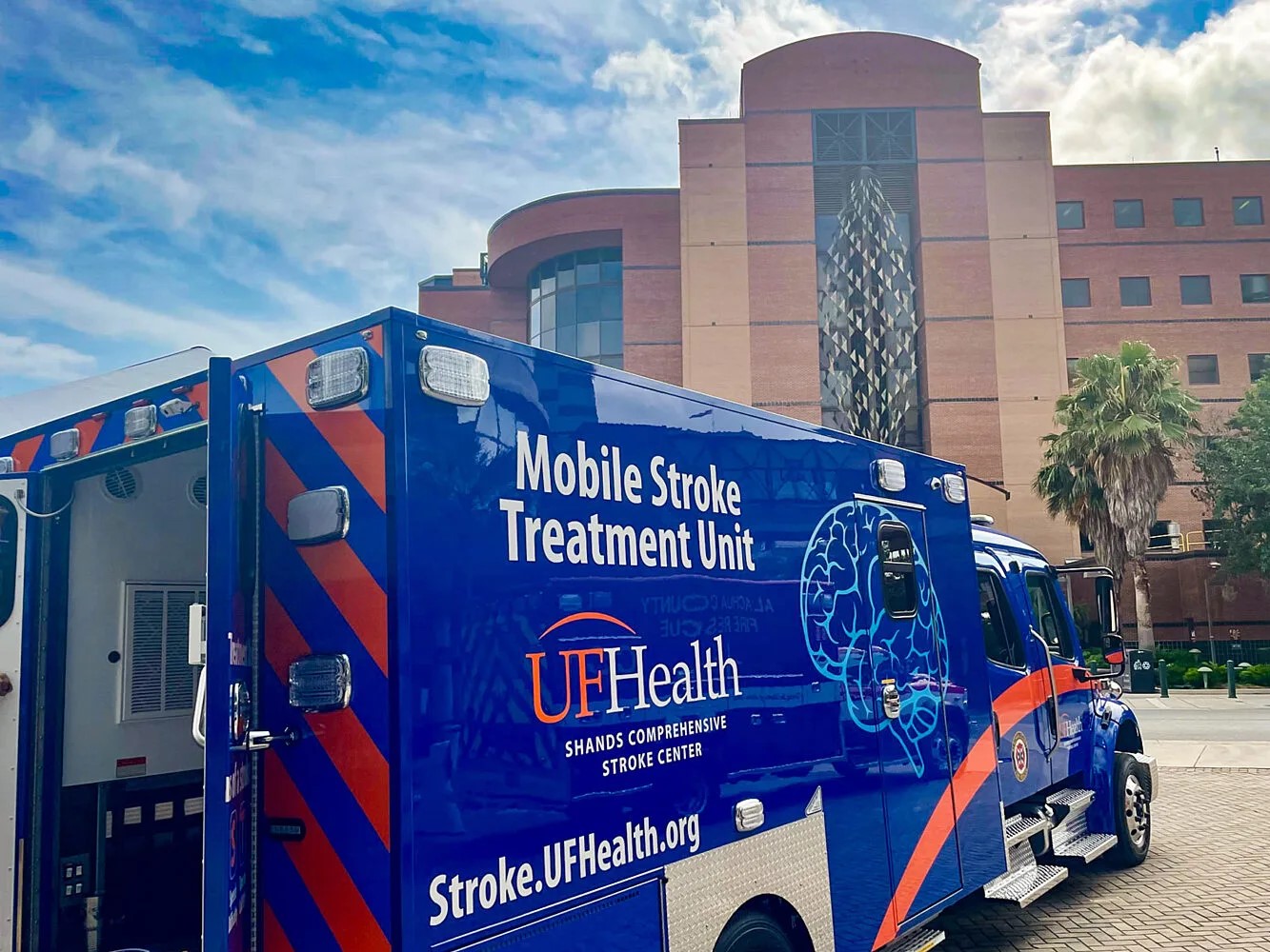 An ambulance painted blue with the words 