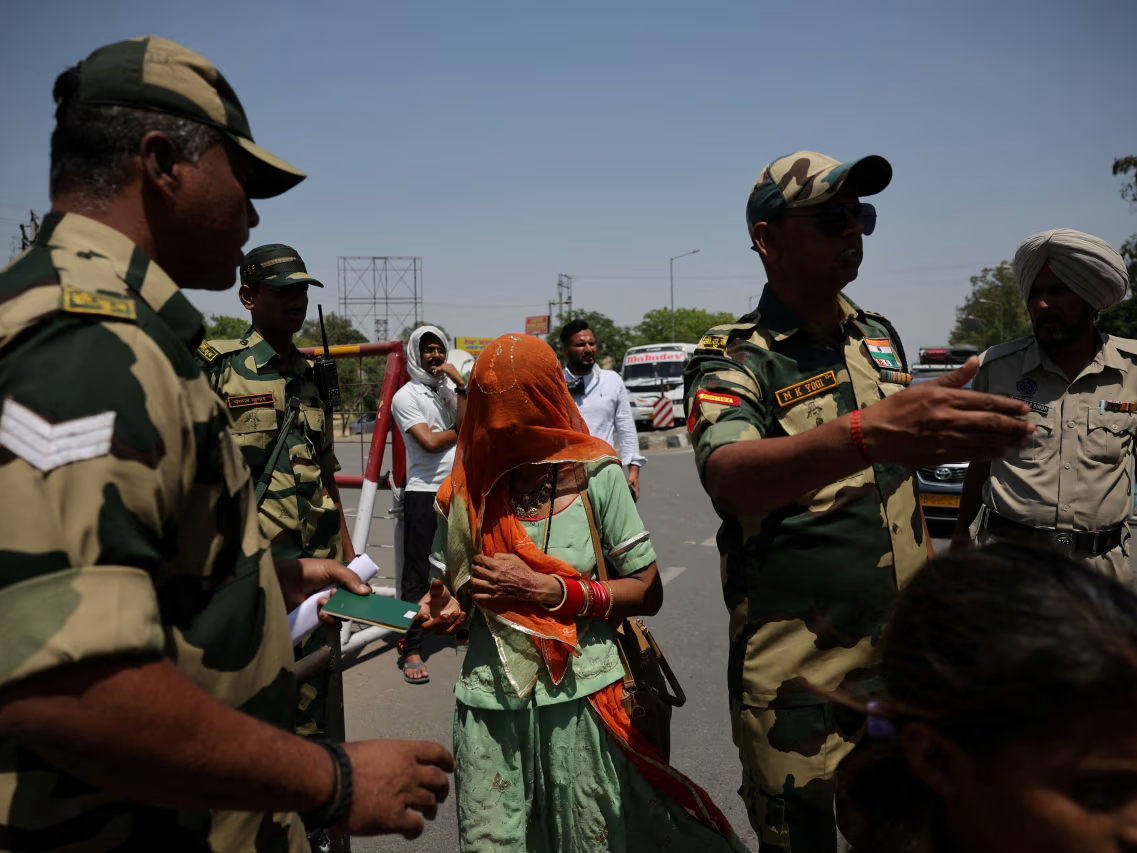 Military personnel check passports at the Attari-Wagah border crossing near Amritsar, India, April 27. PHOTO: ANUSHREE FADNAVIS/REUTERS