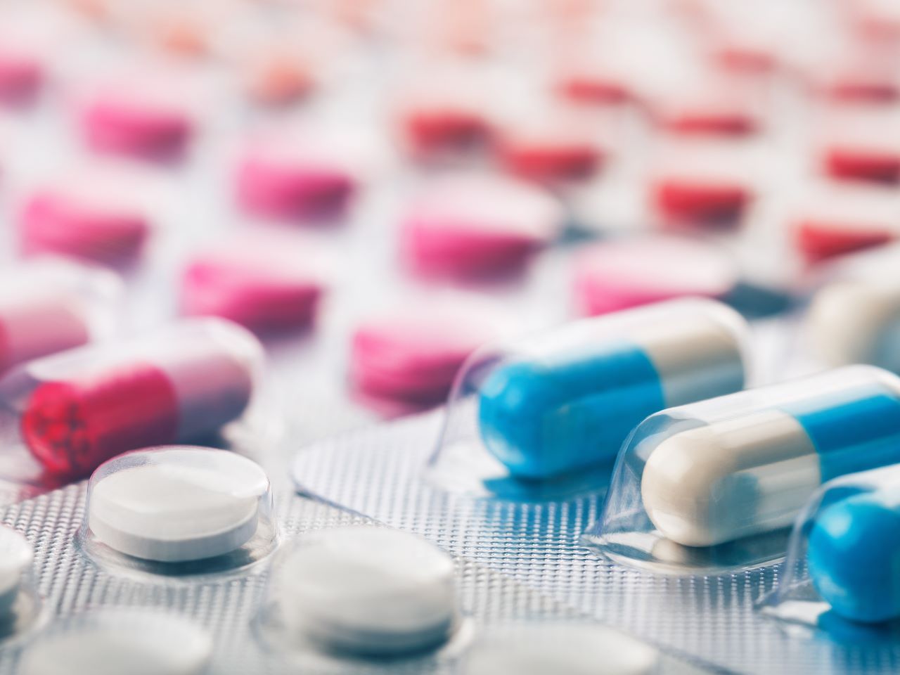 A variety of colorful pharmaceutical drugs in blister packaging