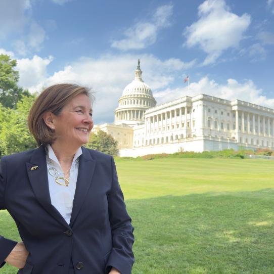Sarah Mathias standing with the US capitol in the background