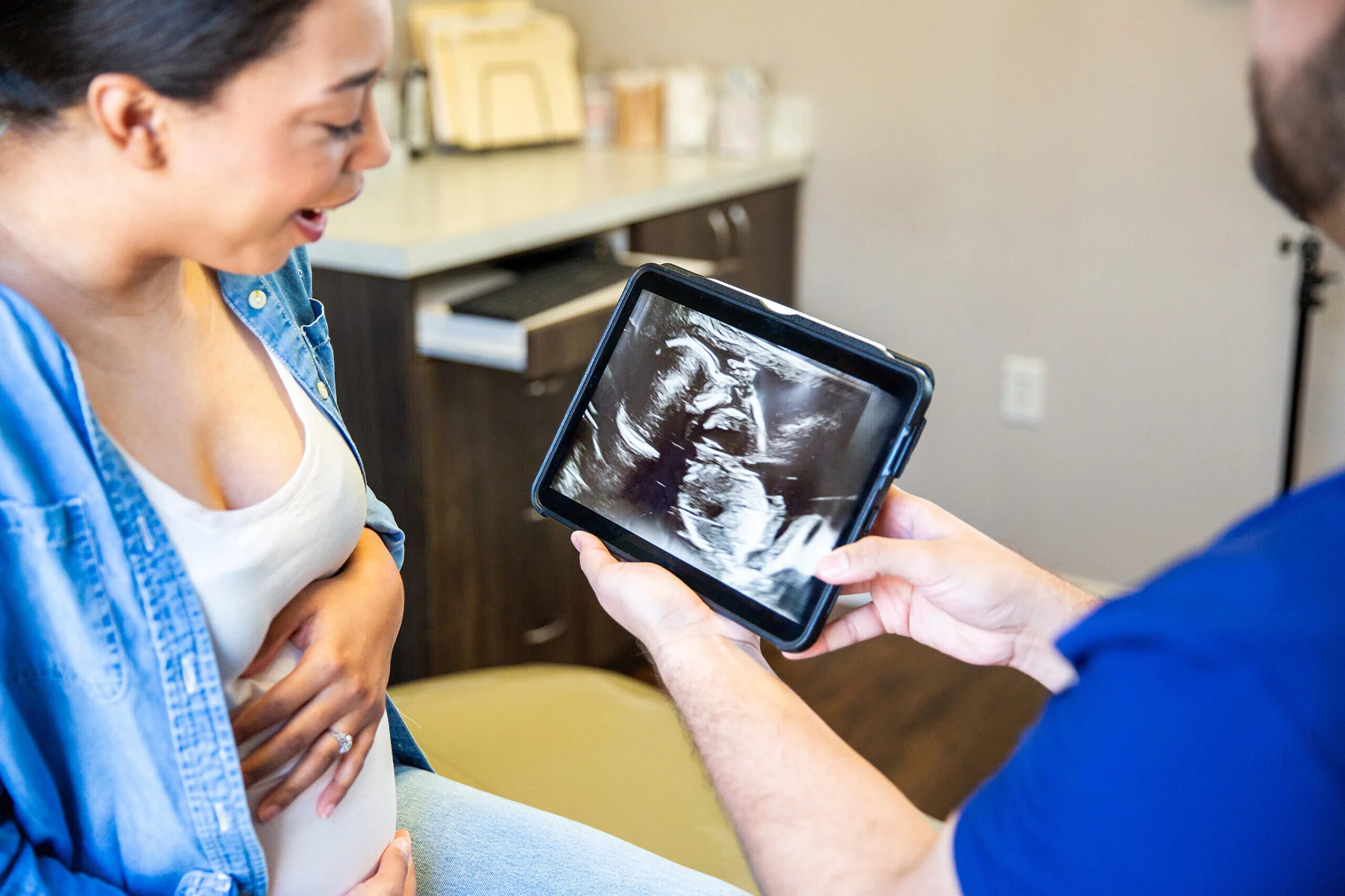 A pregnant woman views an ultrasound of her baby during a doctor's visit. (Getty Images)