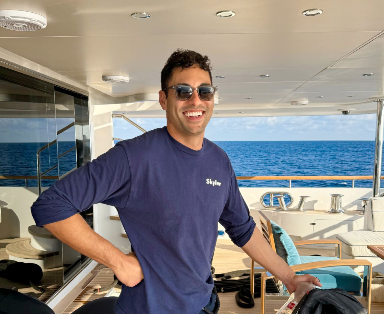 Hugo Ortega poses on a super yacht