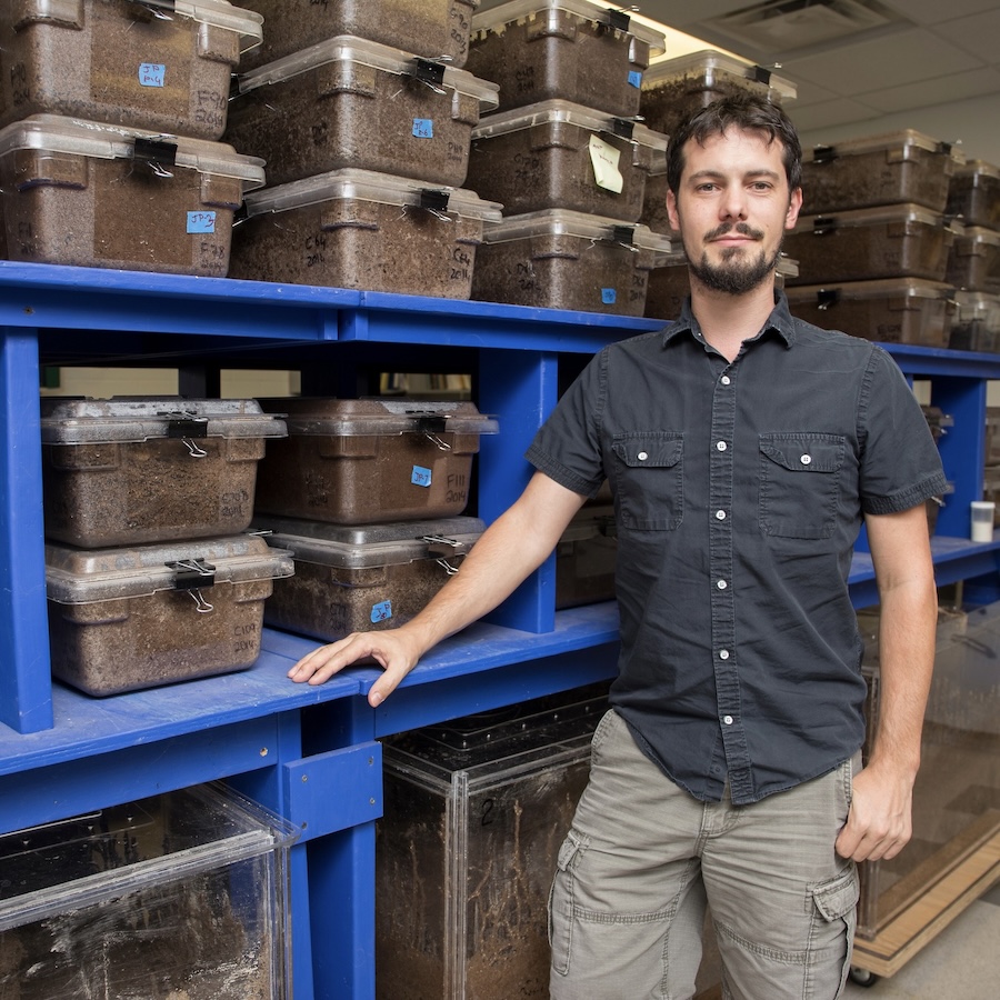 A photo of UF researcher standing in his lab.