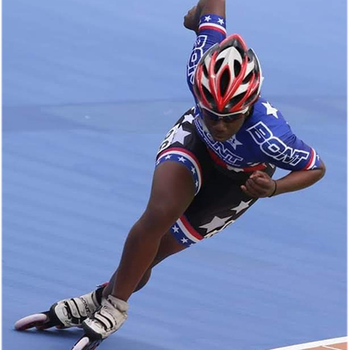 Photo of speed skater racing on the ice